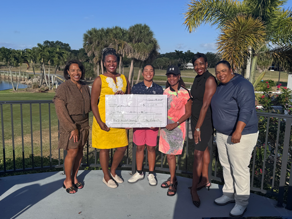 Staci Pla Receives check for $10,000 from ForeSistas Golf